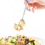 Roasted cauliflower parmesan with fork in view