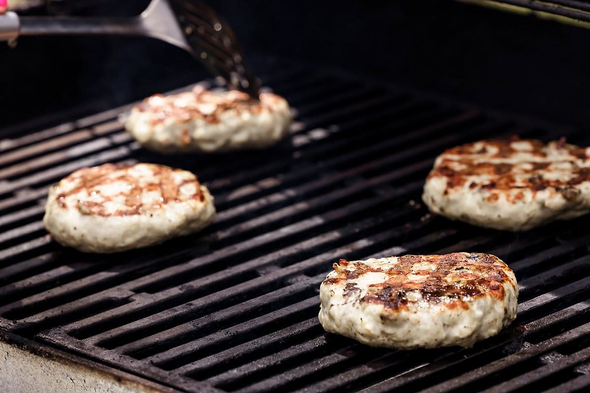 Grilling turkey burger patties.
