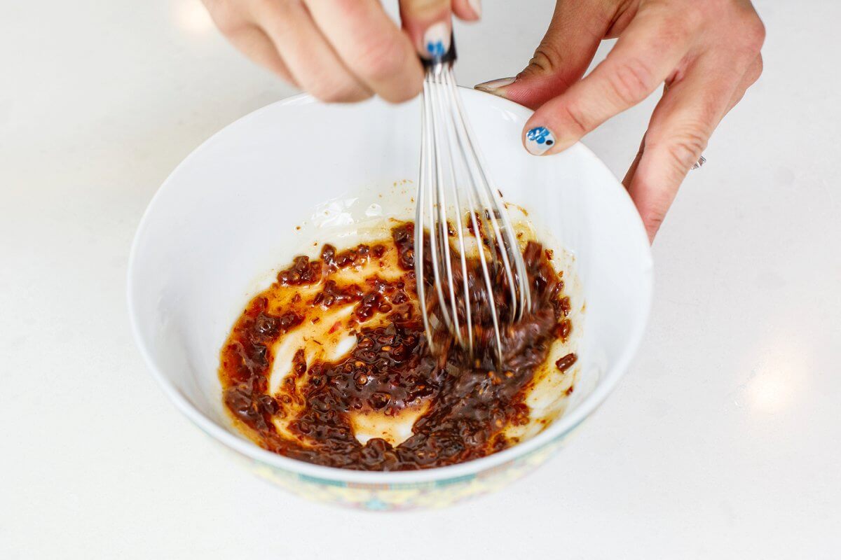 Liz whisking marinade