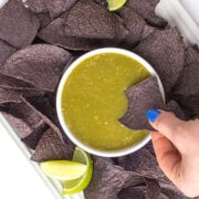 Salsa verde with blue tortilla chips