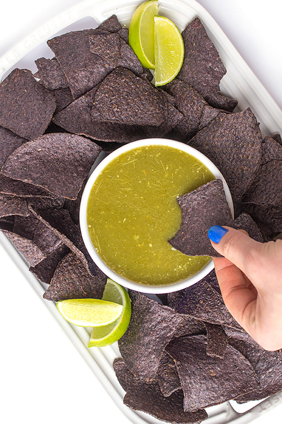 Salsa verde with blue tortilla chips