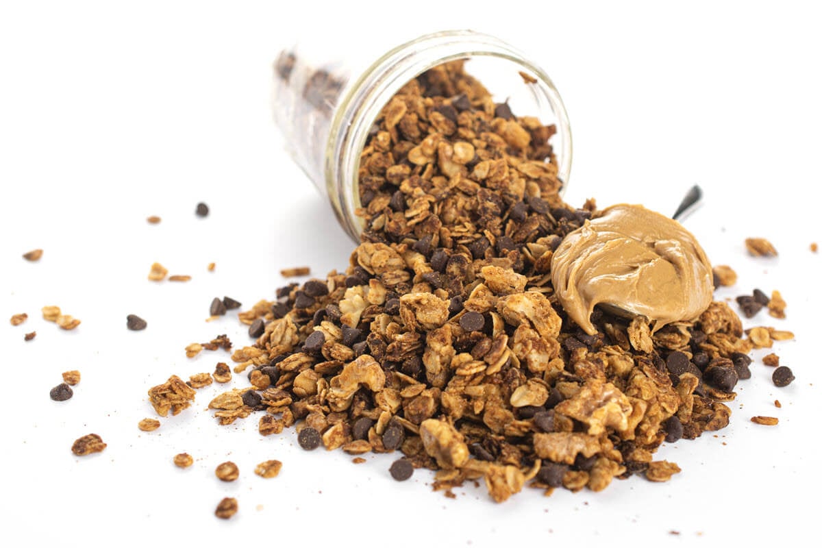 Homemade peanut butter chocolate Granola with peanut butter on a spoon