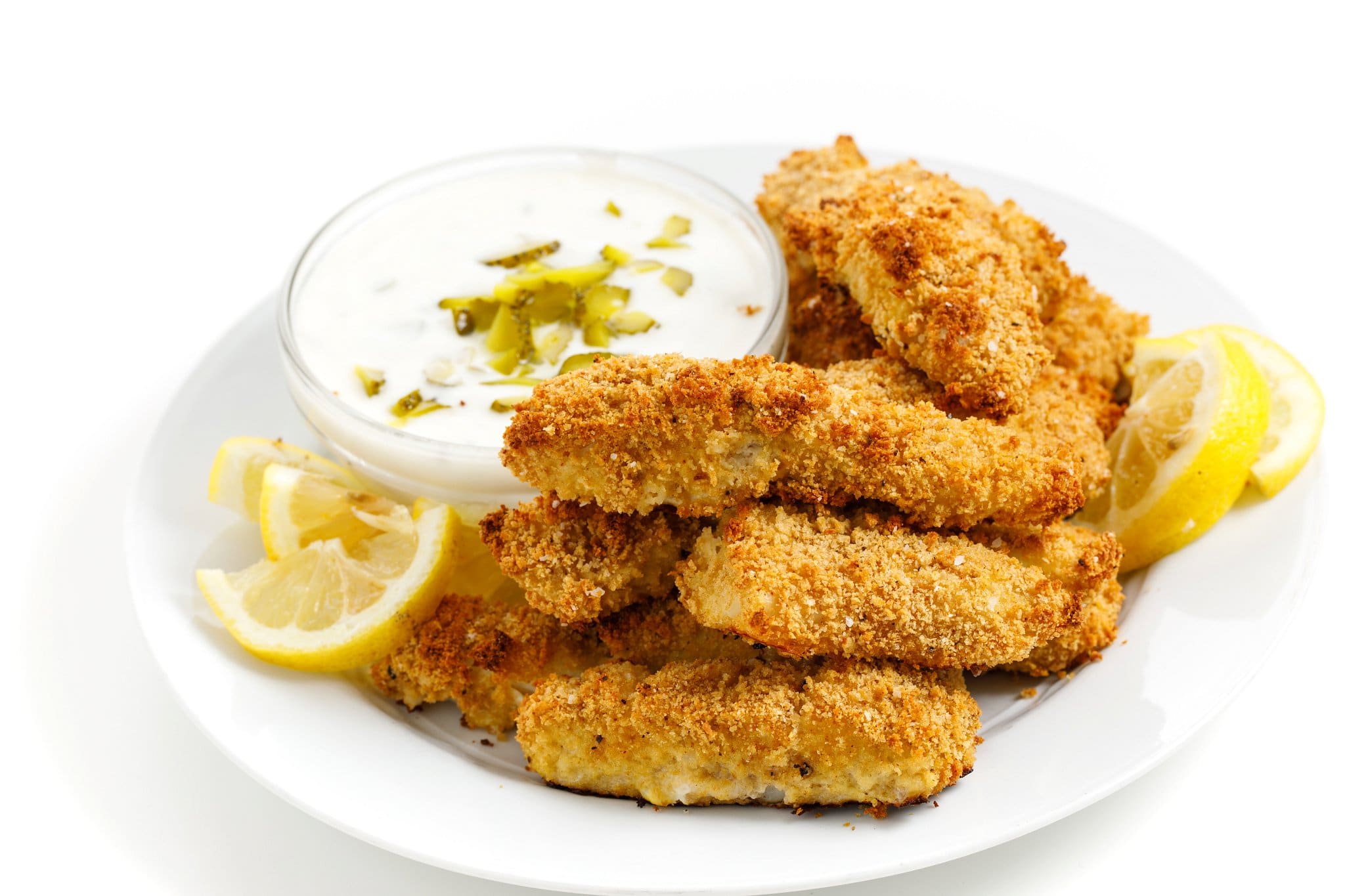 Crispy baked fish sticks with tartar sauce.
