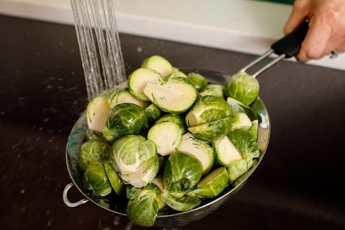Brussels sprouts being rinsed