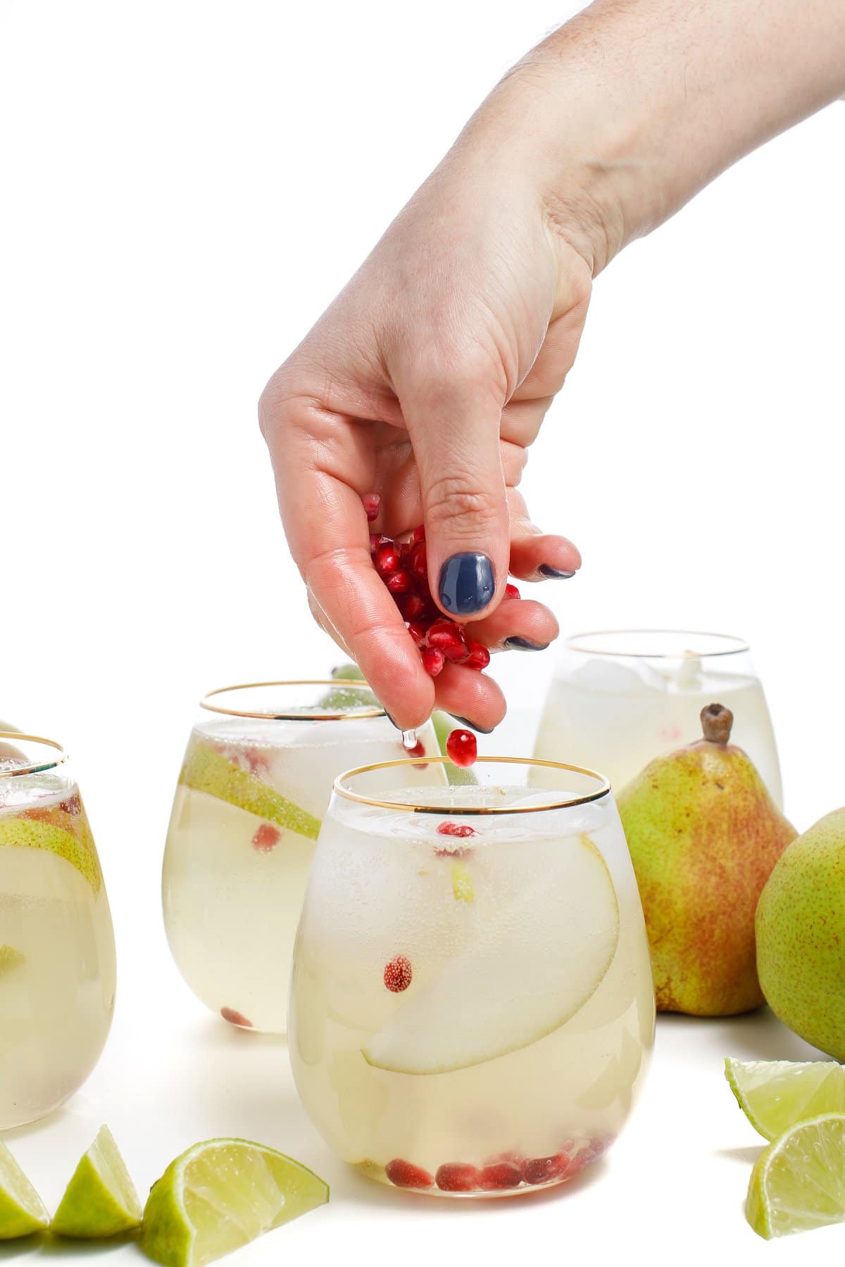 Moscow Mule Being Garnished with Pomegranate Seeds