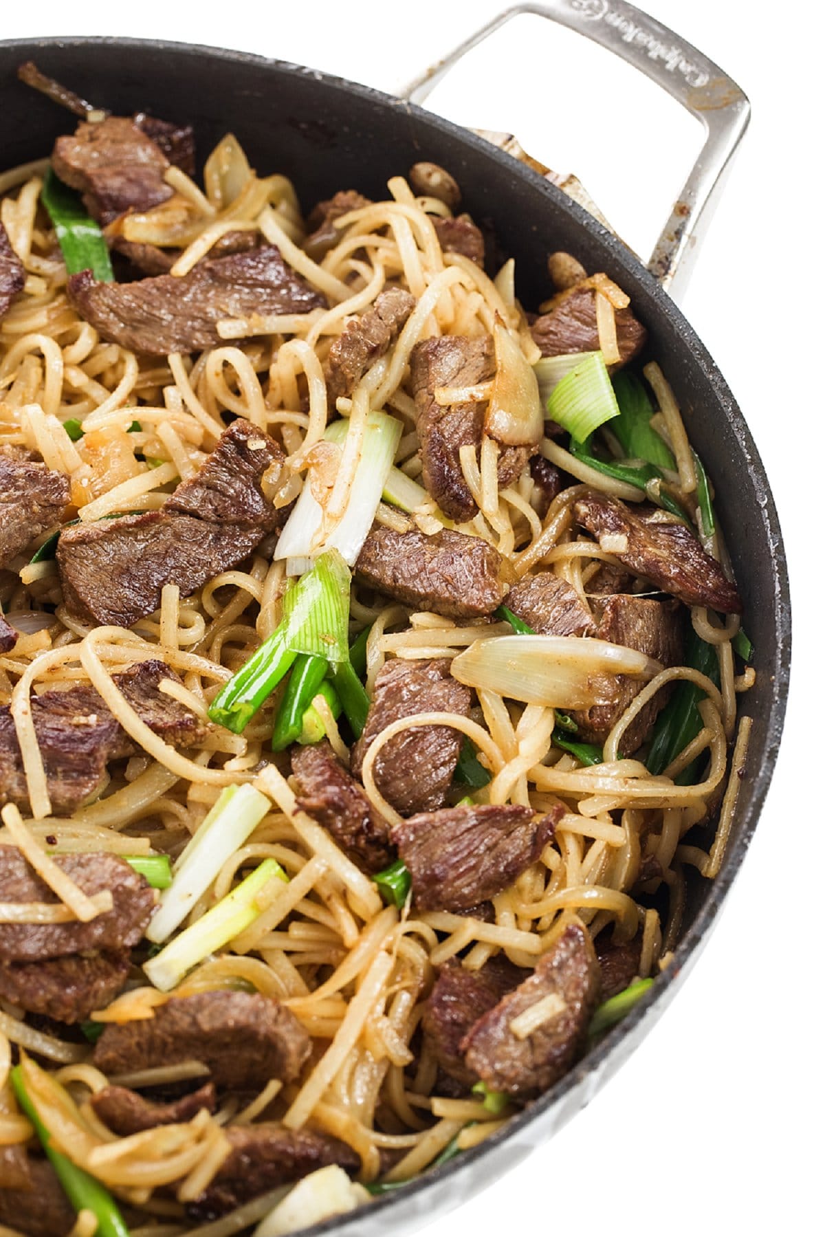 Beef Stir Fry with rice noodles in a skillet.