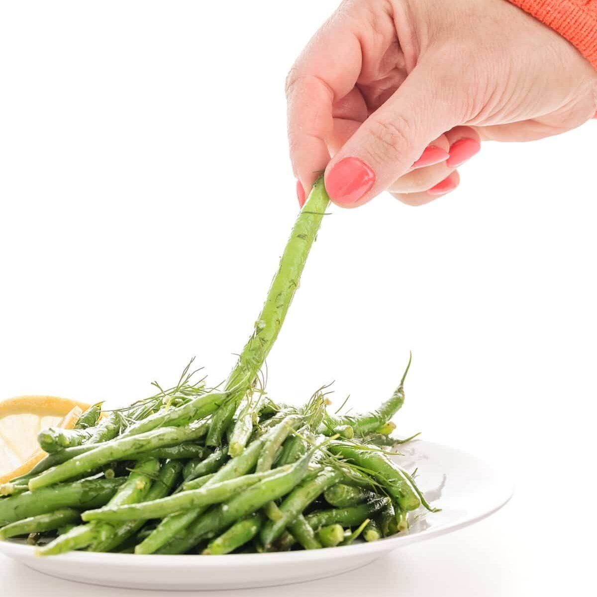 grabbing a lemon dill green bean