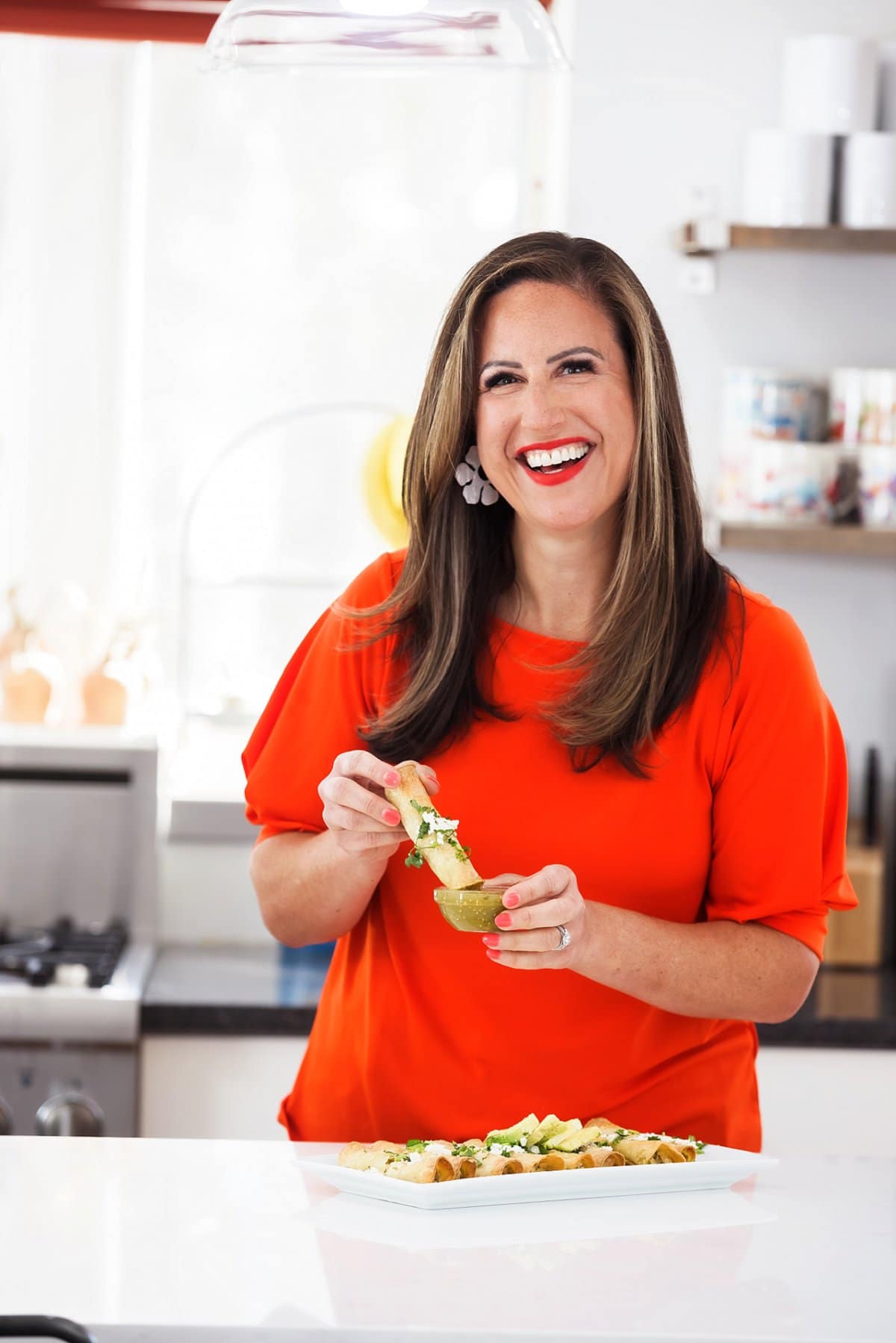 Liz eating baked chicken taquitos