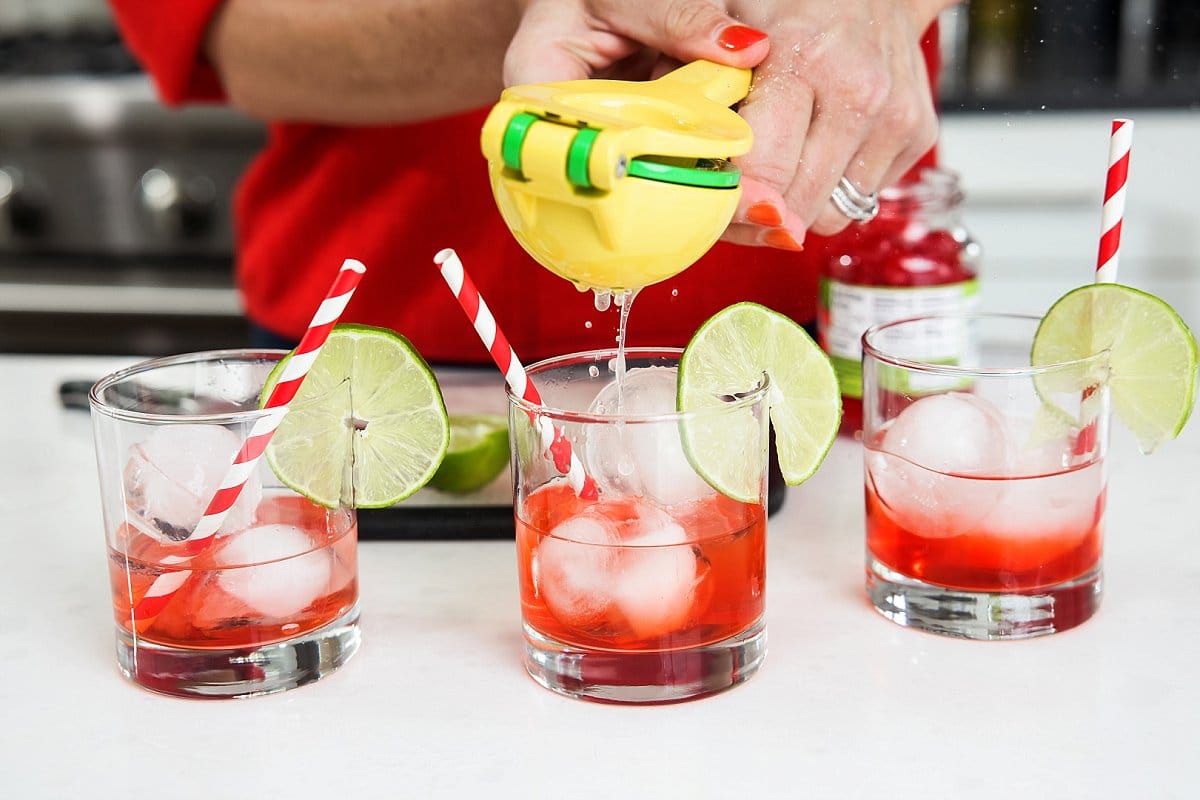 squeezing lime into glasses