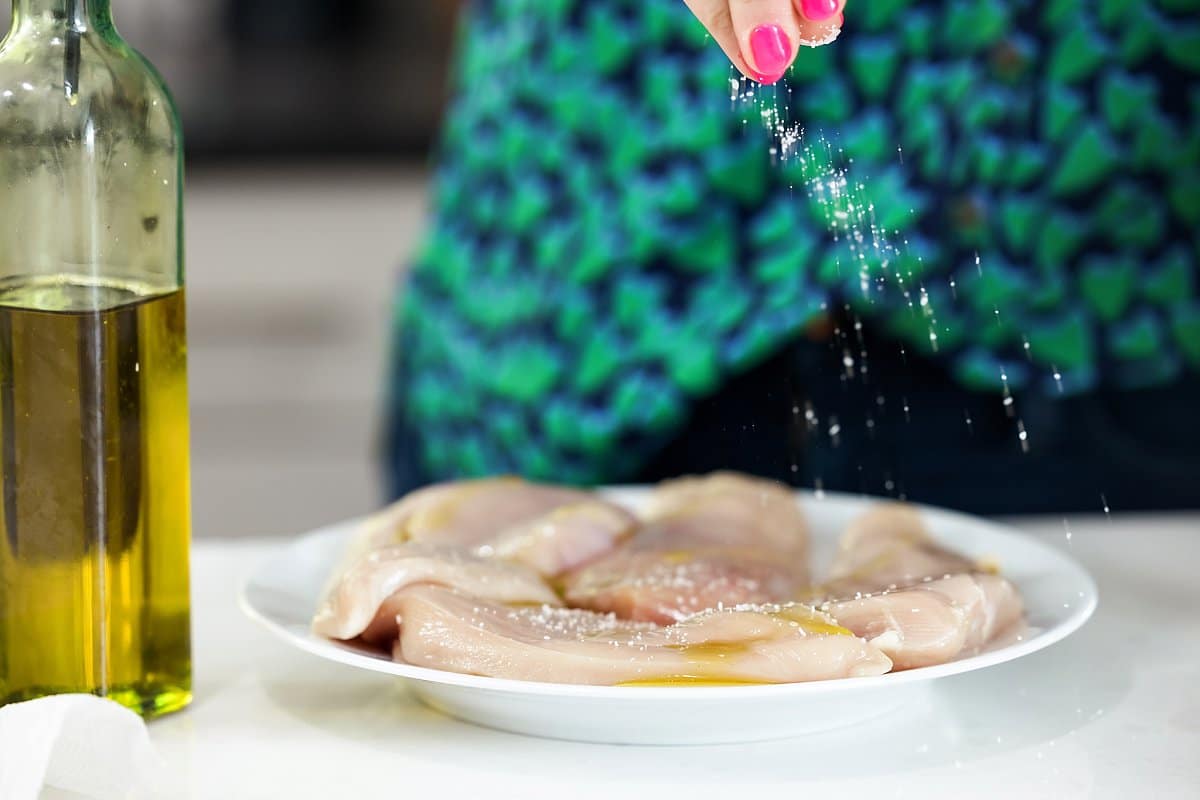 Seasoning Chicken with salt