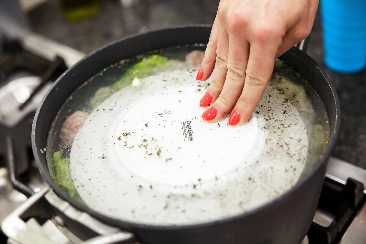 A plate on top of cabbage rolls