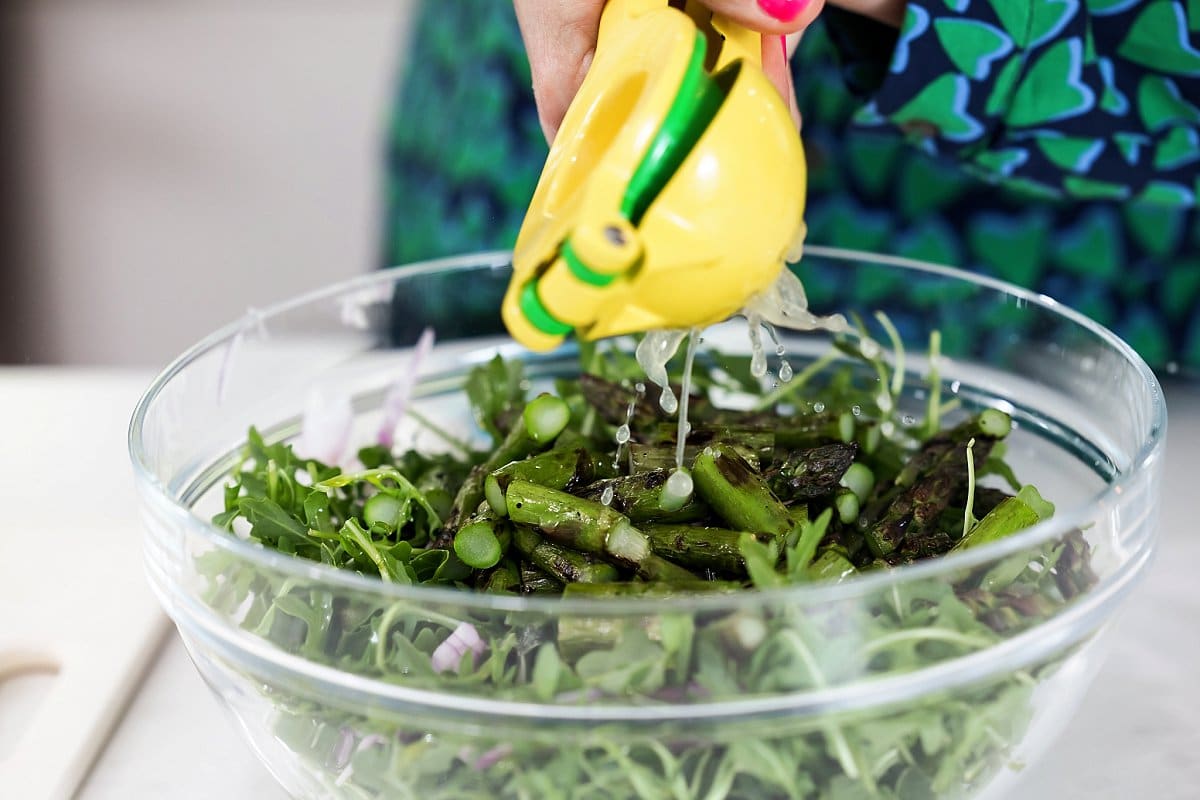 Liz Adding Lemon Juice to Salad