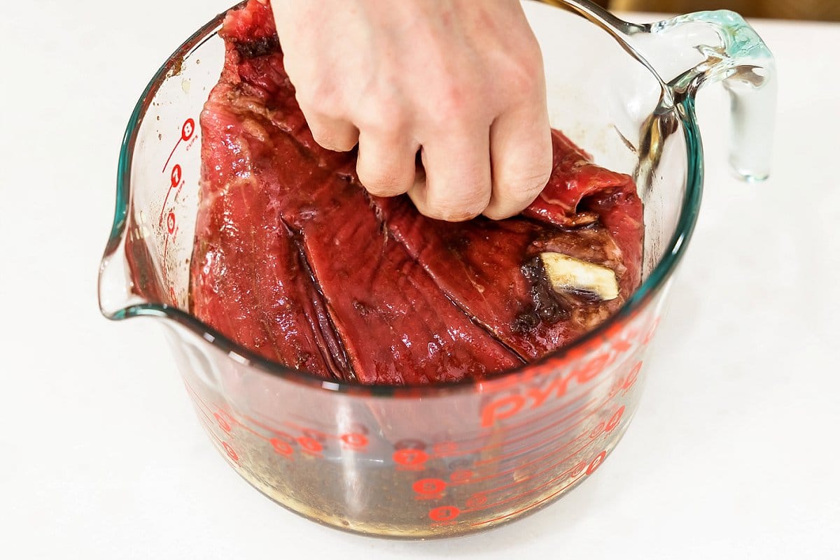 flank steak in a pyrex cup