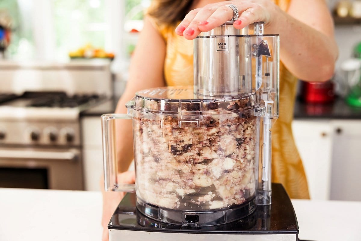 blending vegan blueberry nice cream in a food processor