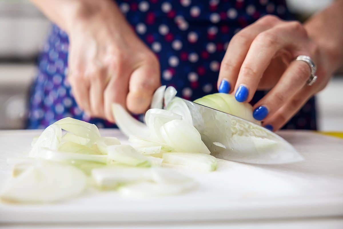 chopping onions for shredded beef