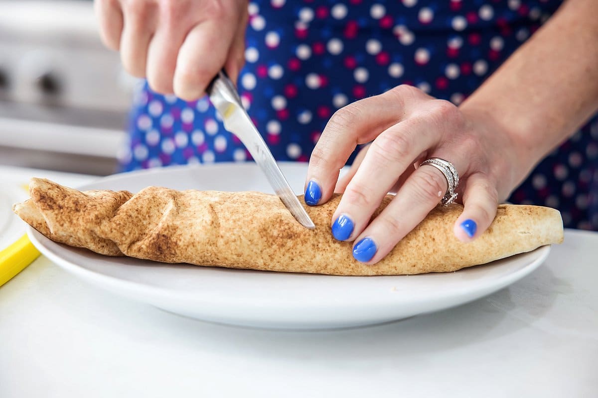 cutting lebanese salad wraps