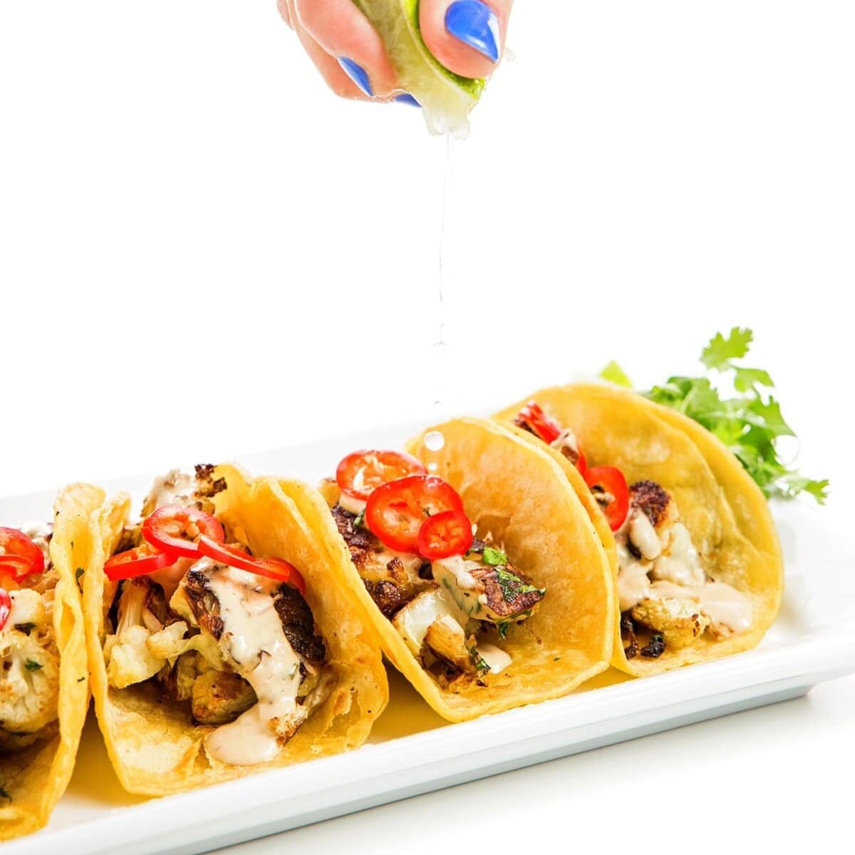 roasted cauliflower tacos with chipotle tahini sauce