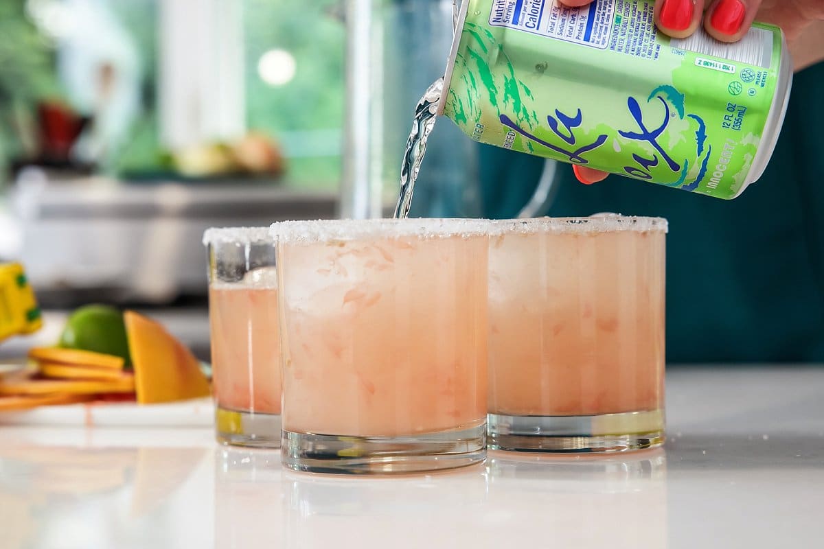 Liz pouring club soda