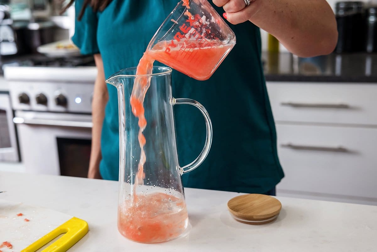 Liz pouring grapefruit juice