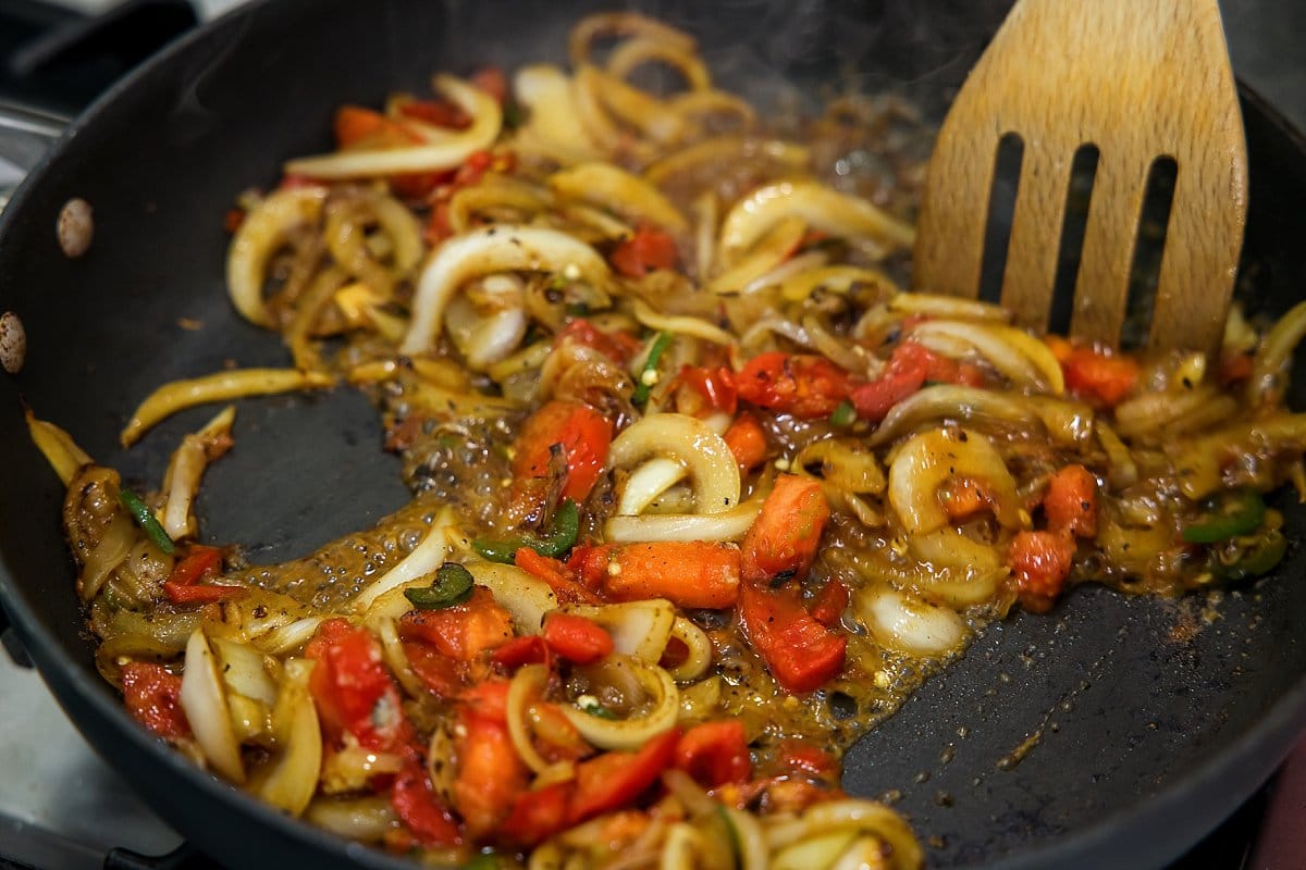 Onion jalapeno and tomato sauteing