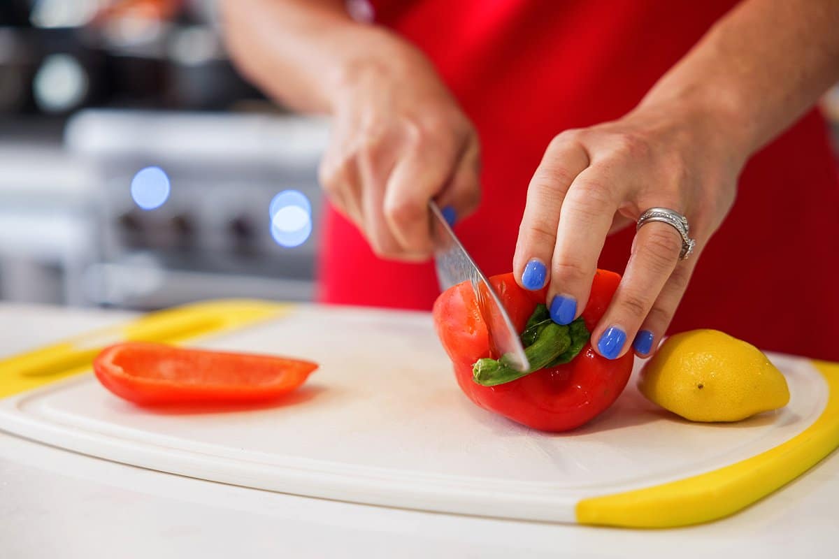 Liz chopping red bell pepper