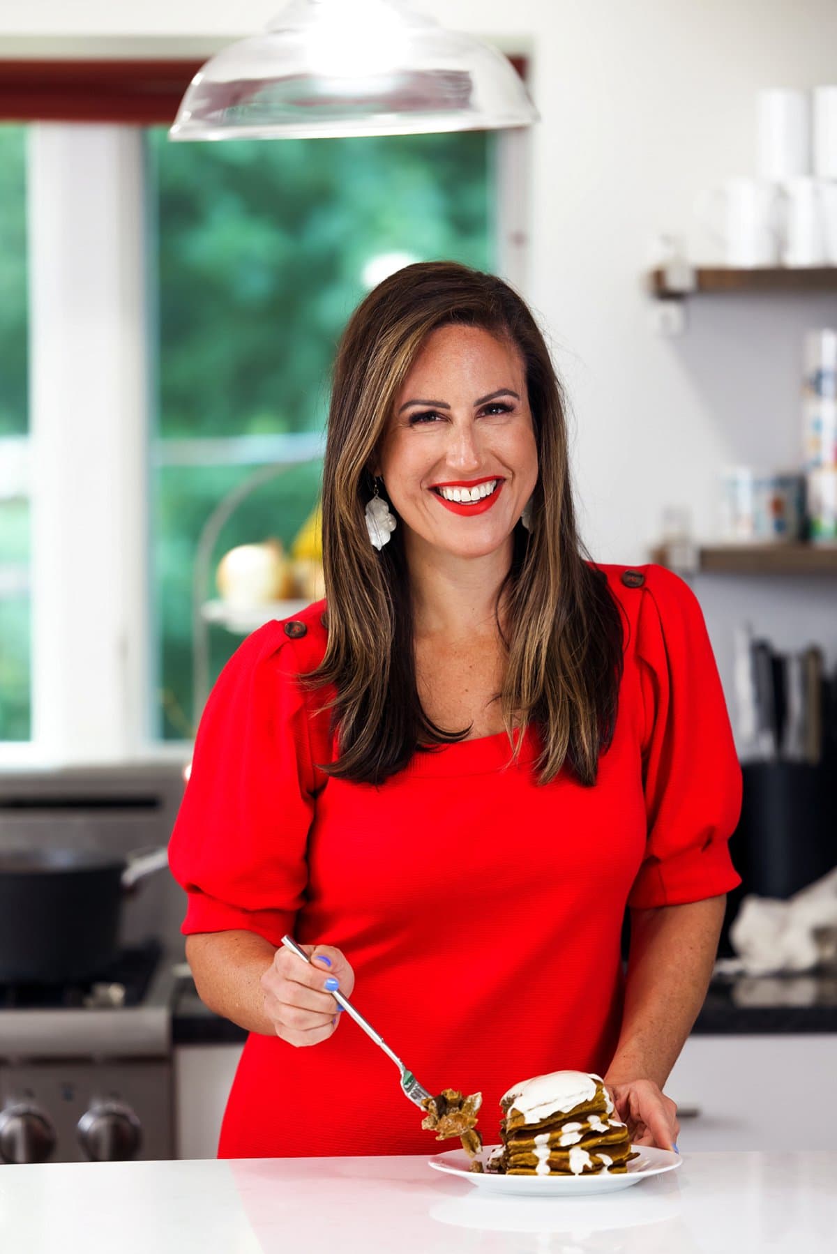 Liz enjoying gluten free pumpkin pancakes.