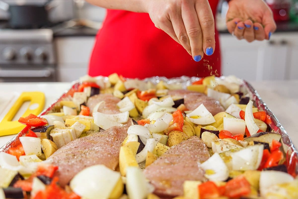 Seasoning chicken and veggies