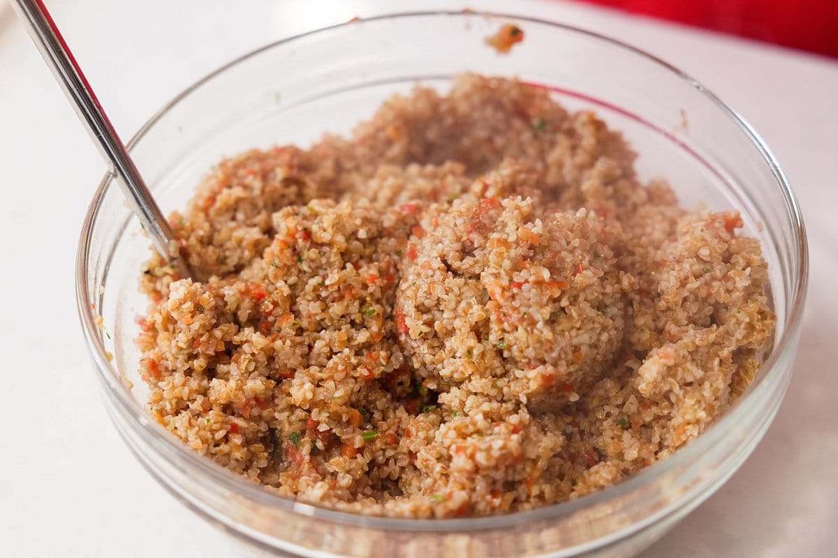Tomato kibbeh mixed in bowl