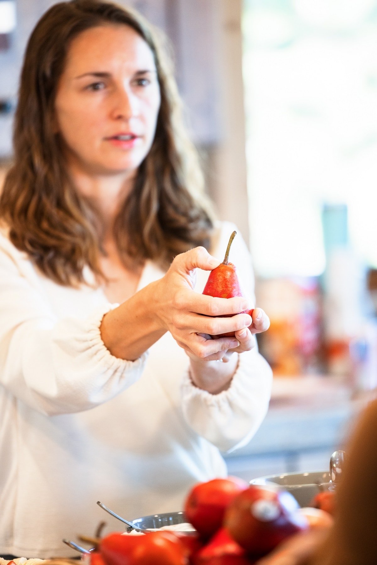 Checking pear neck for ripeness.
