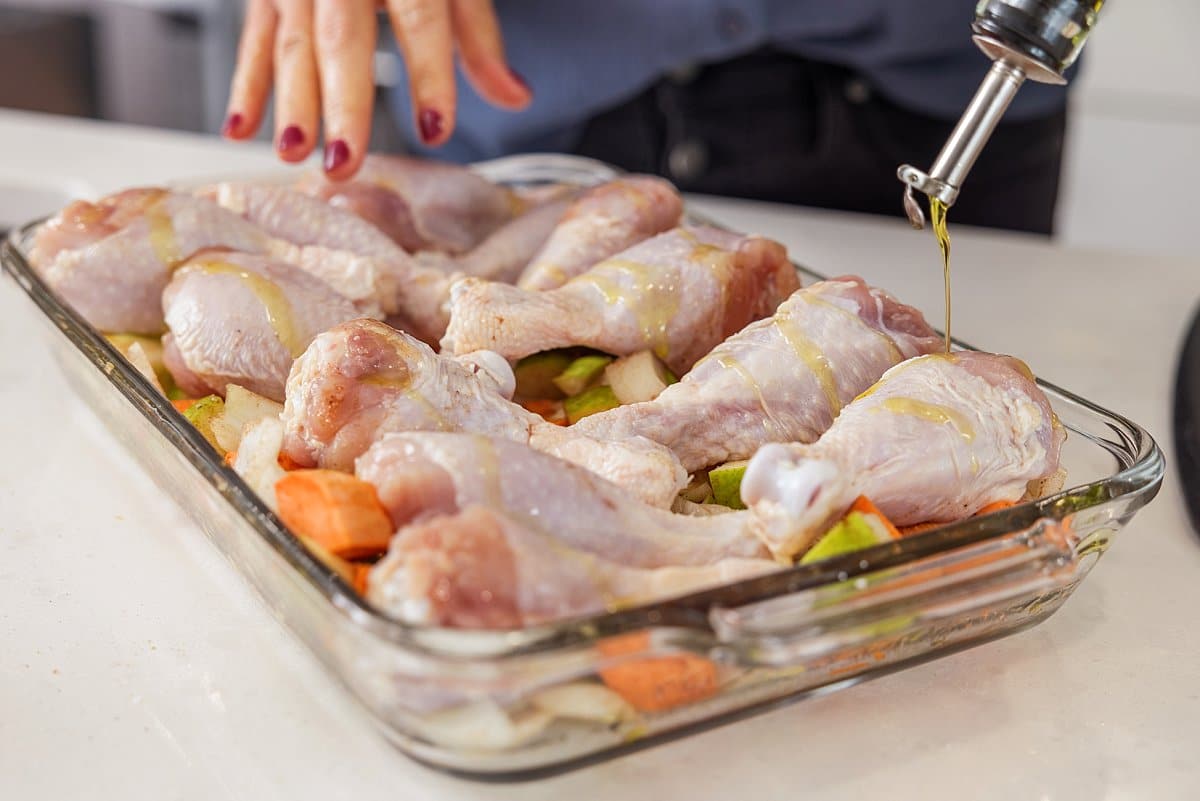 Chicken drumsticks in  pan (raw)