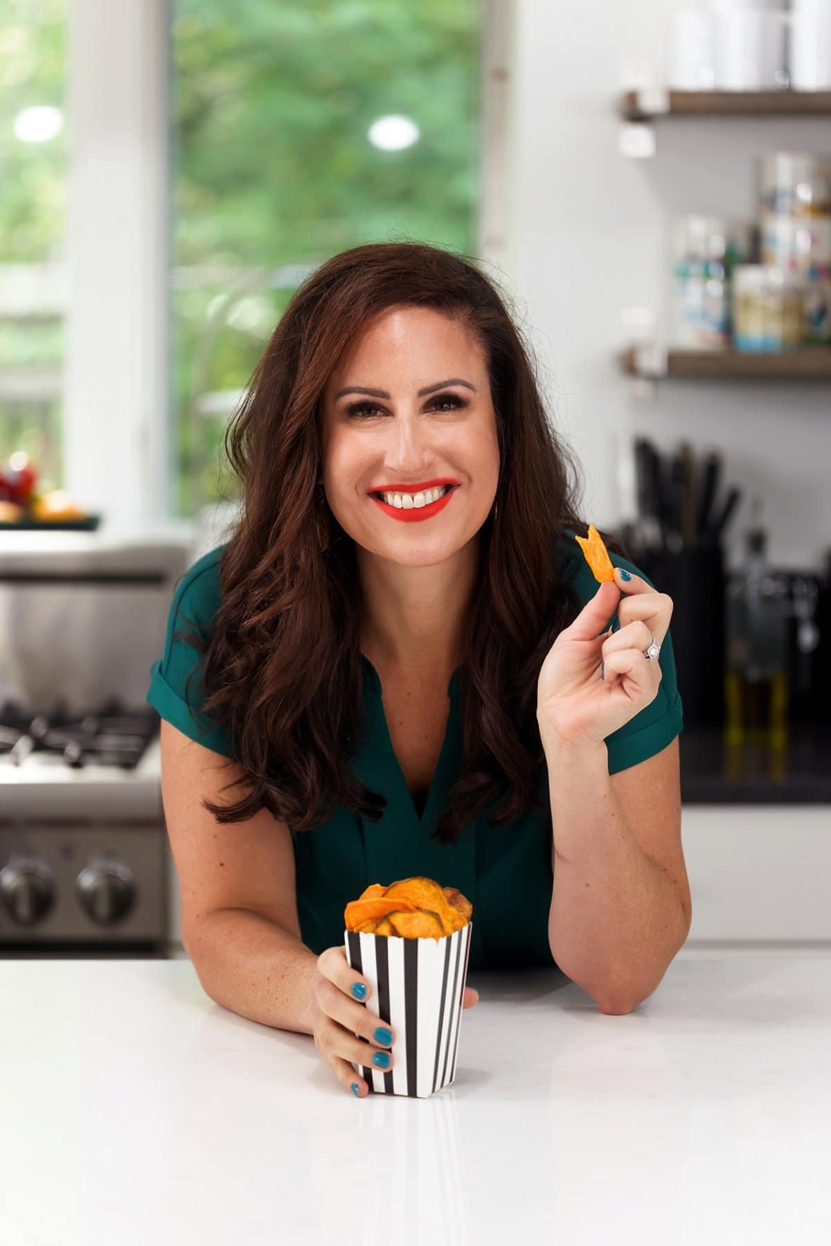 Liz enjoying air fryer sweet potato chips.