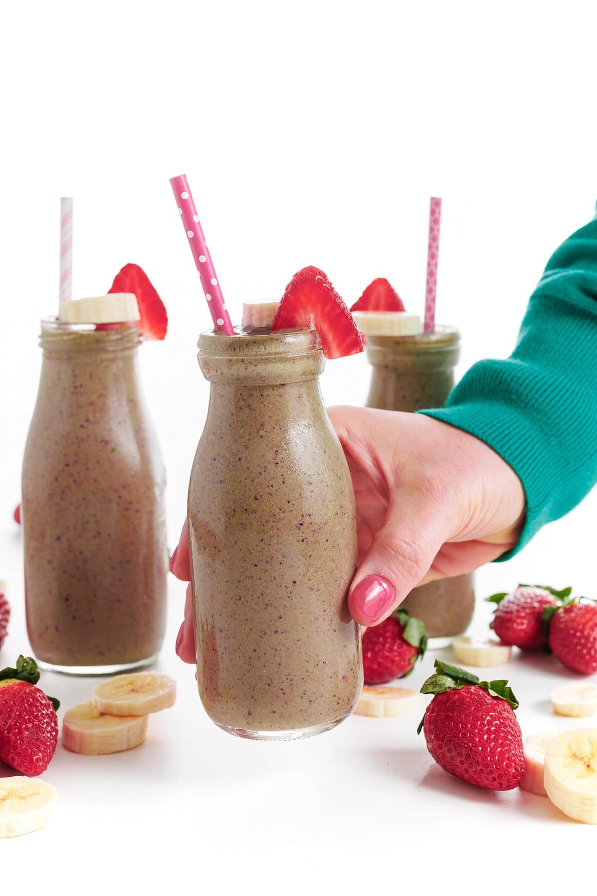 Liz holding a Berry spinach protein smoothie.
