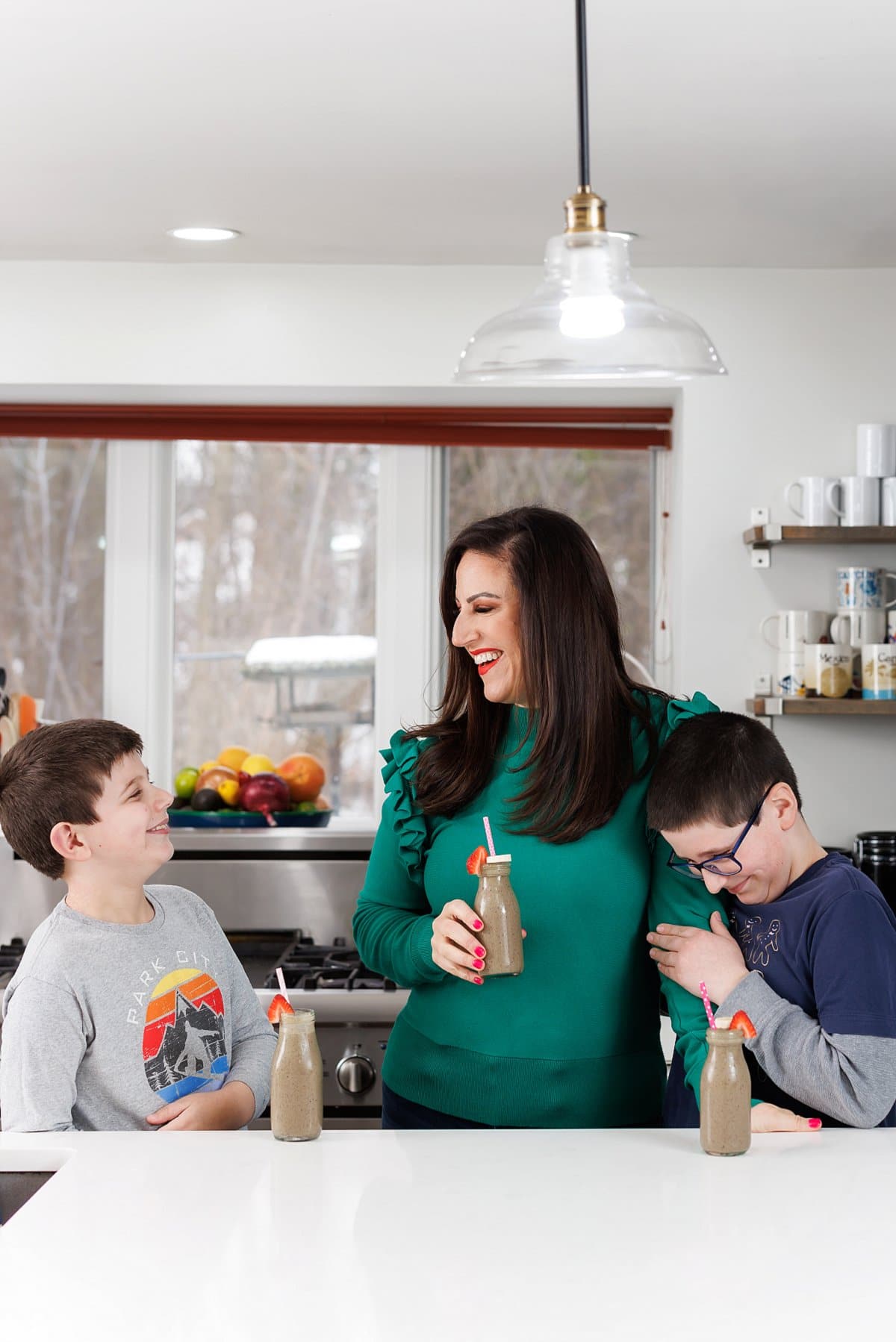 Liz and kids enjoying Berry spinach protein smoothie.