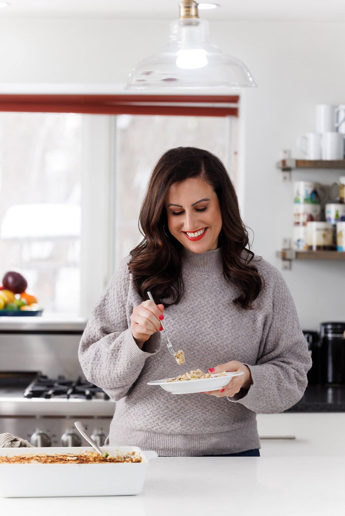 Liz eating creamy tuna noodle casserole.