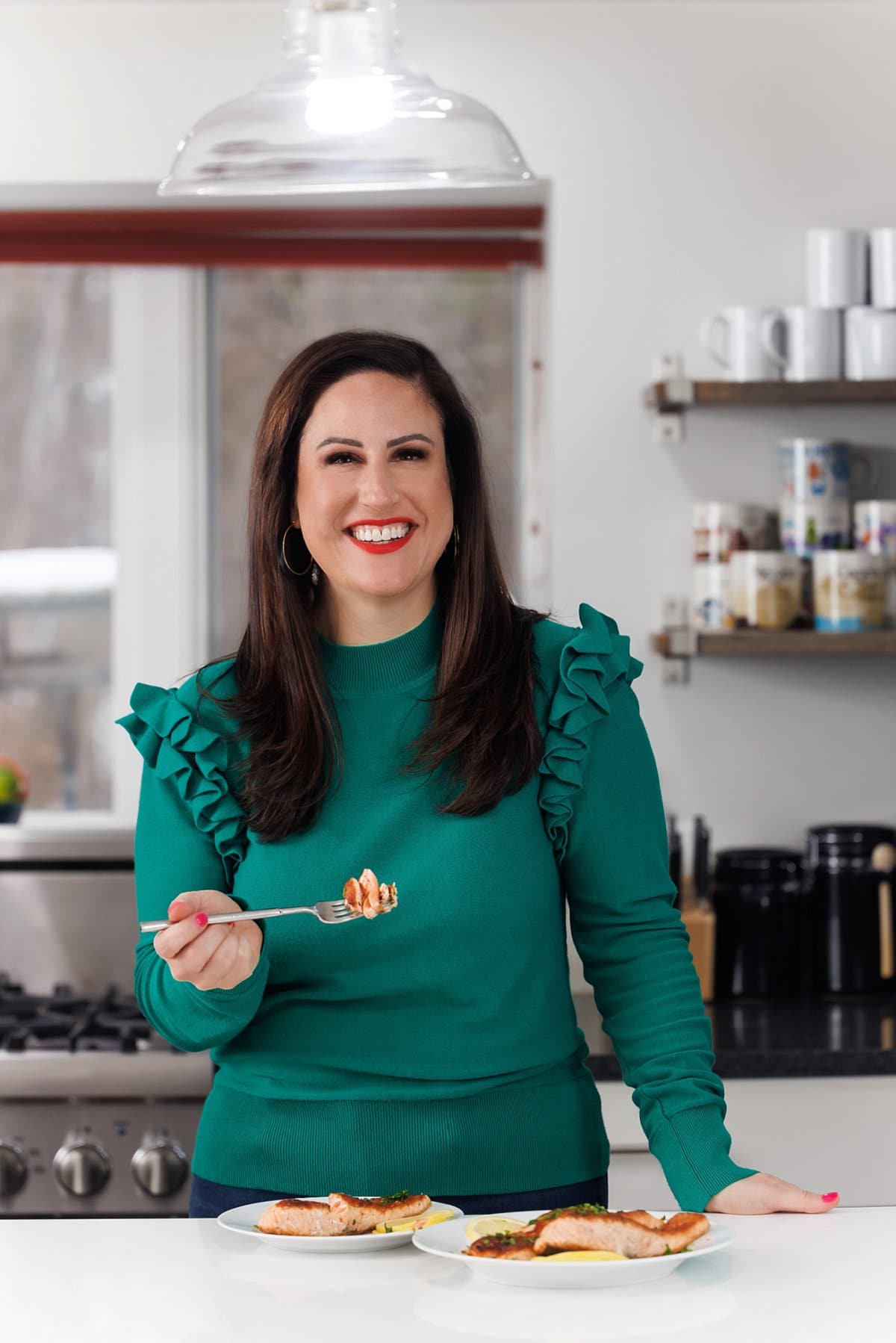 Liz eating easy pan seared salmon.