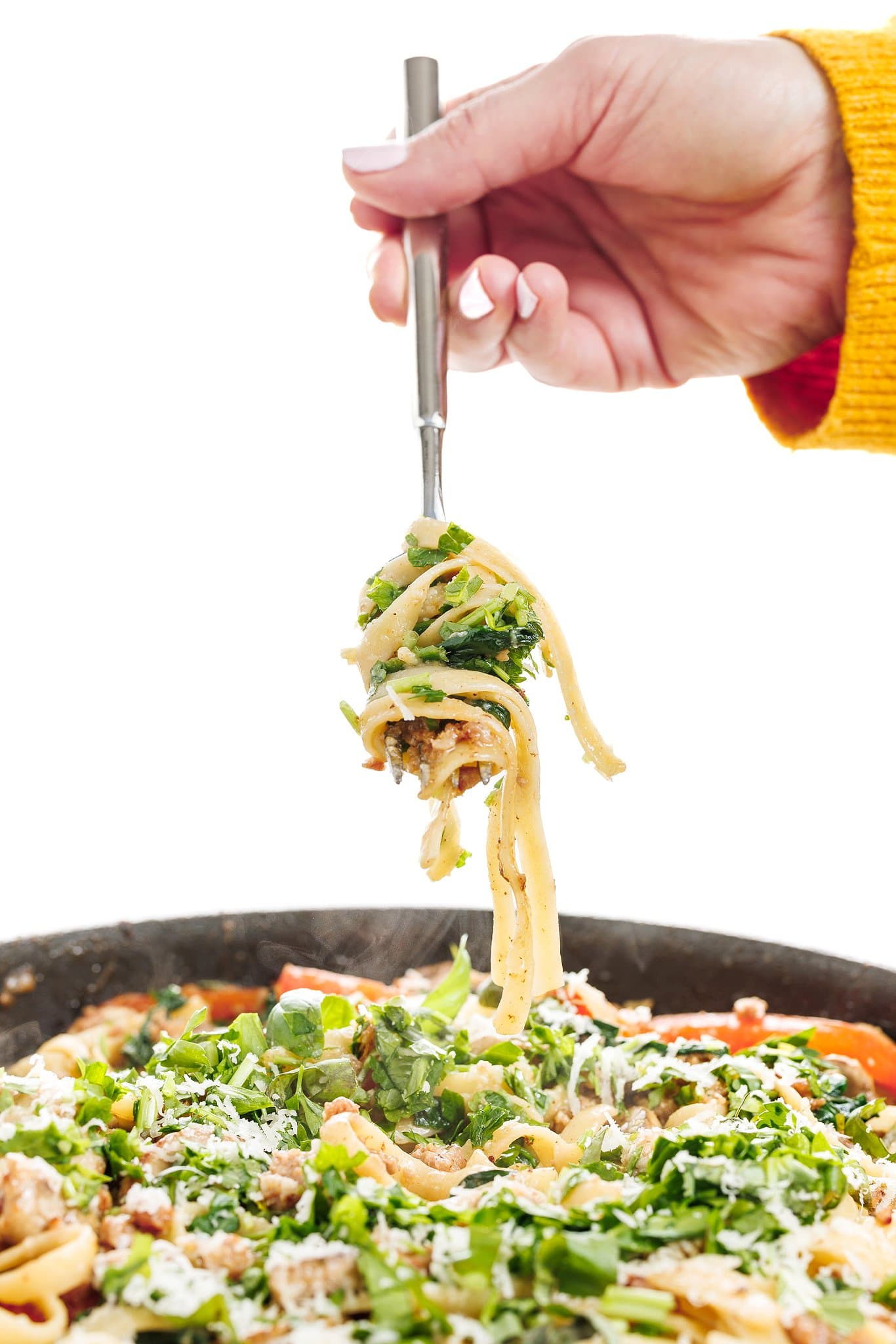 Forkful of one-pan italian sausage pasta.