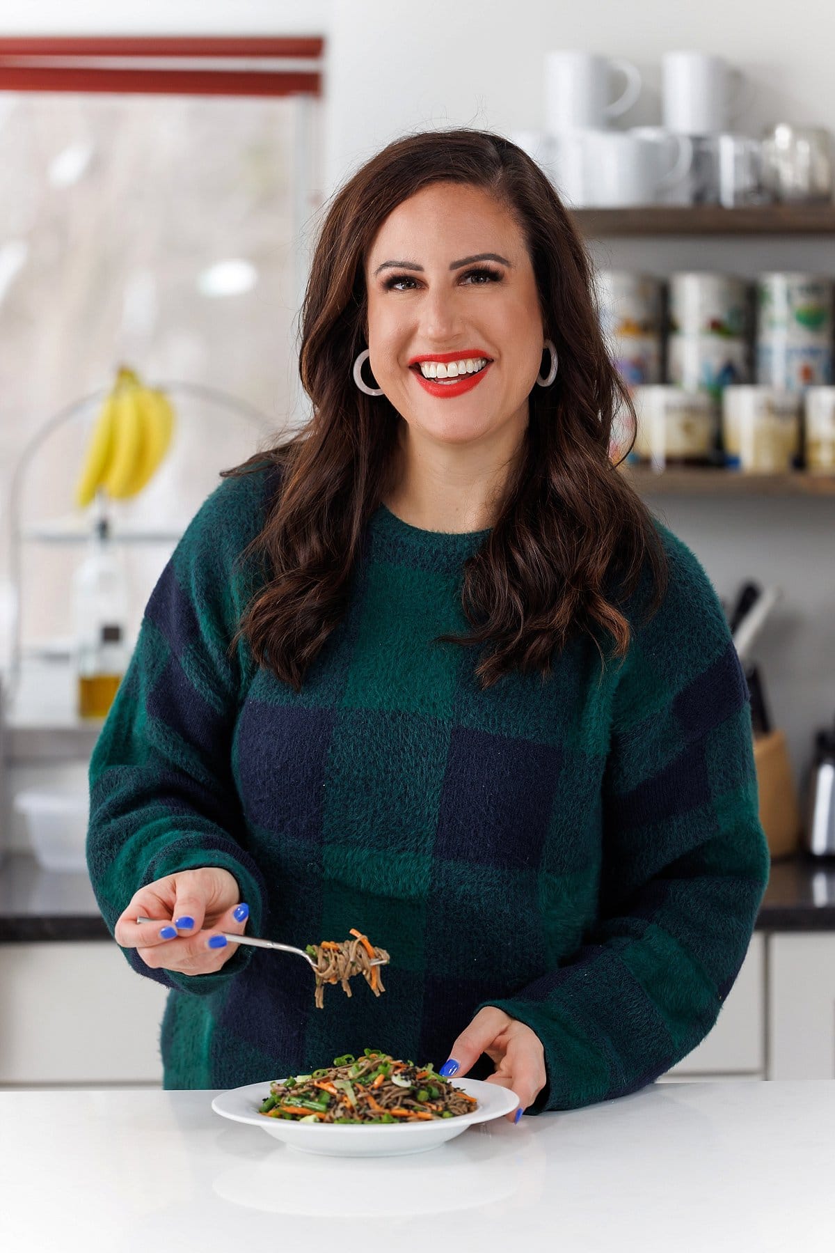 Liz eating soba noodle salad with sesame ginger soy vinaigrette.