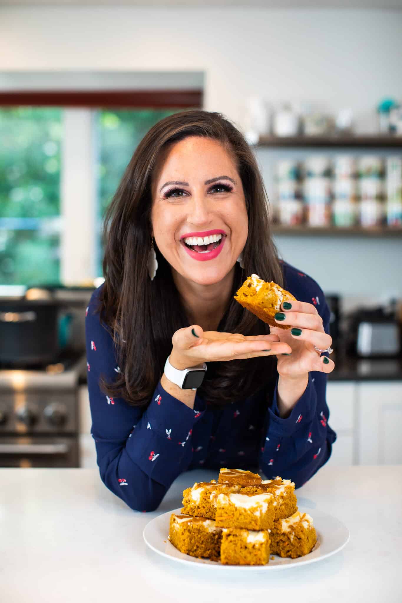 Liz enjoying pumpkin bars with cream cheese frosting.