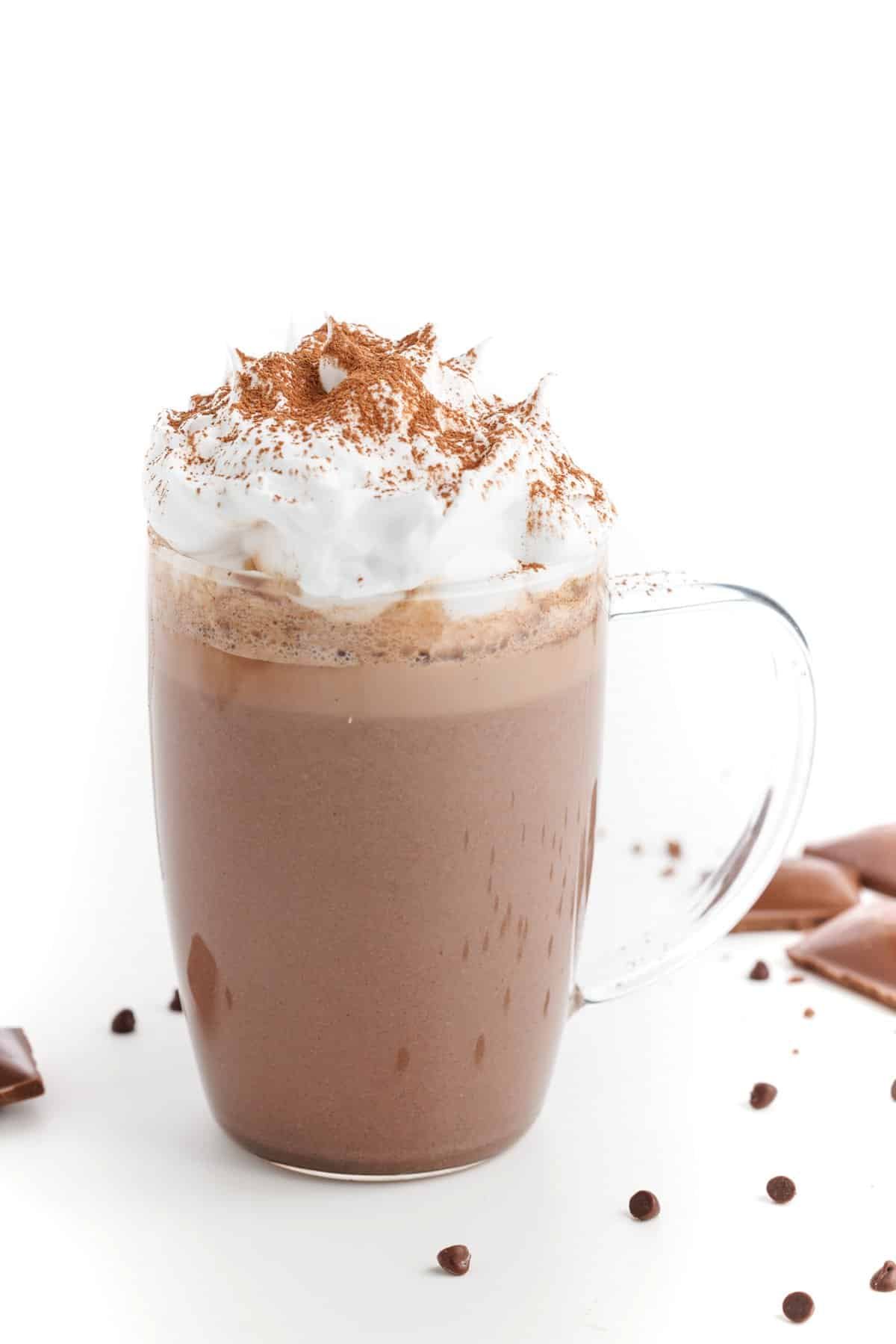 Dark chocolate hot cocoa in a glass mug.