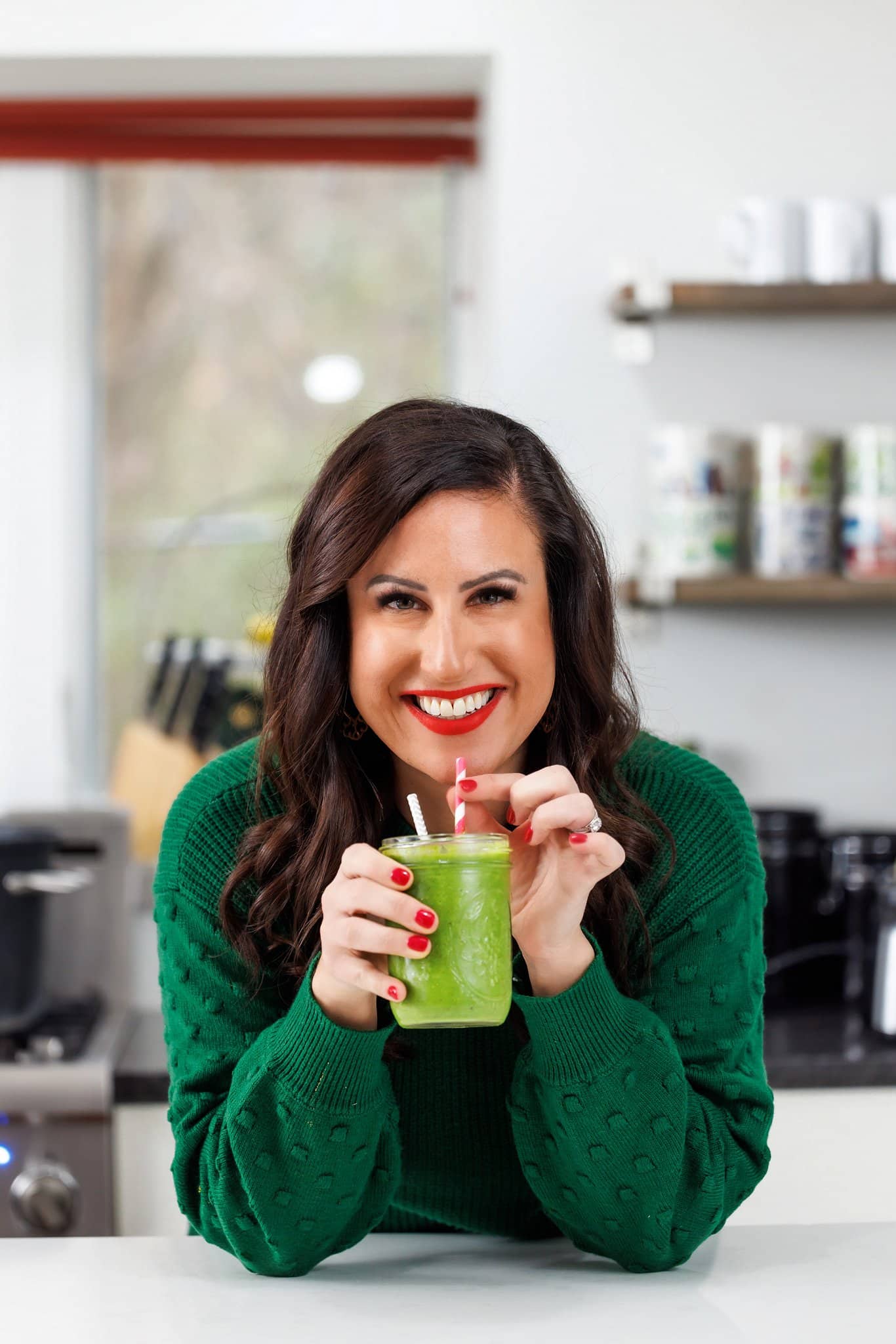 Liz drinking a green detox smoothie.