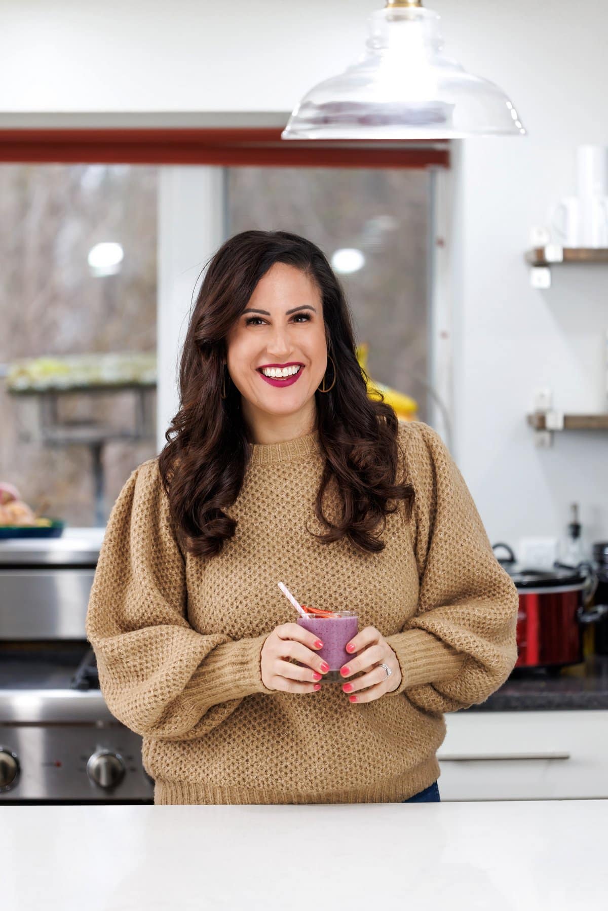 Liz drinking a berry ginger chia smoothie.