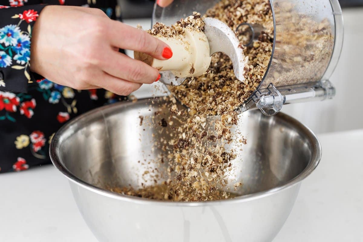 Adding oat mixture to bowl.