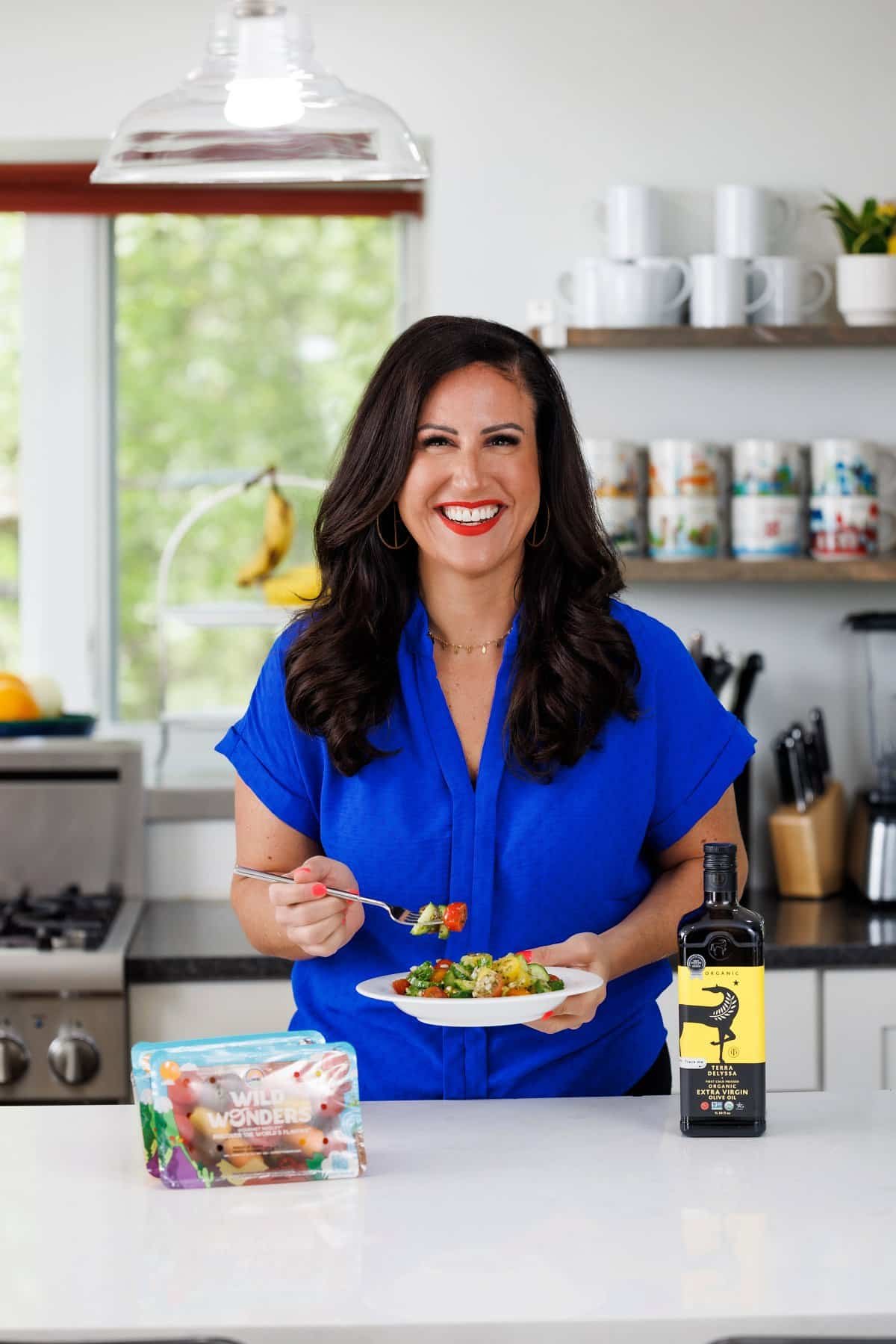 Liz eating Mediterranean chopped salad.