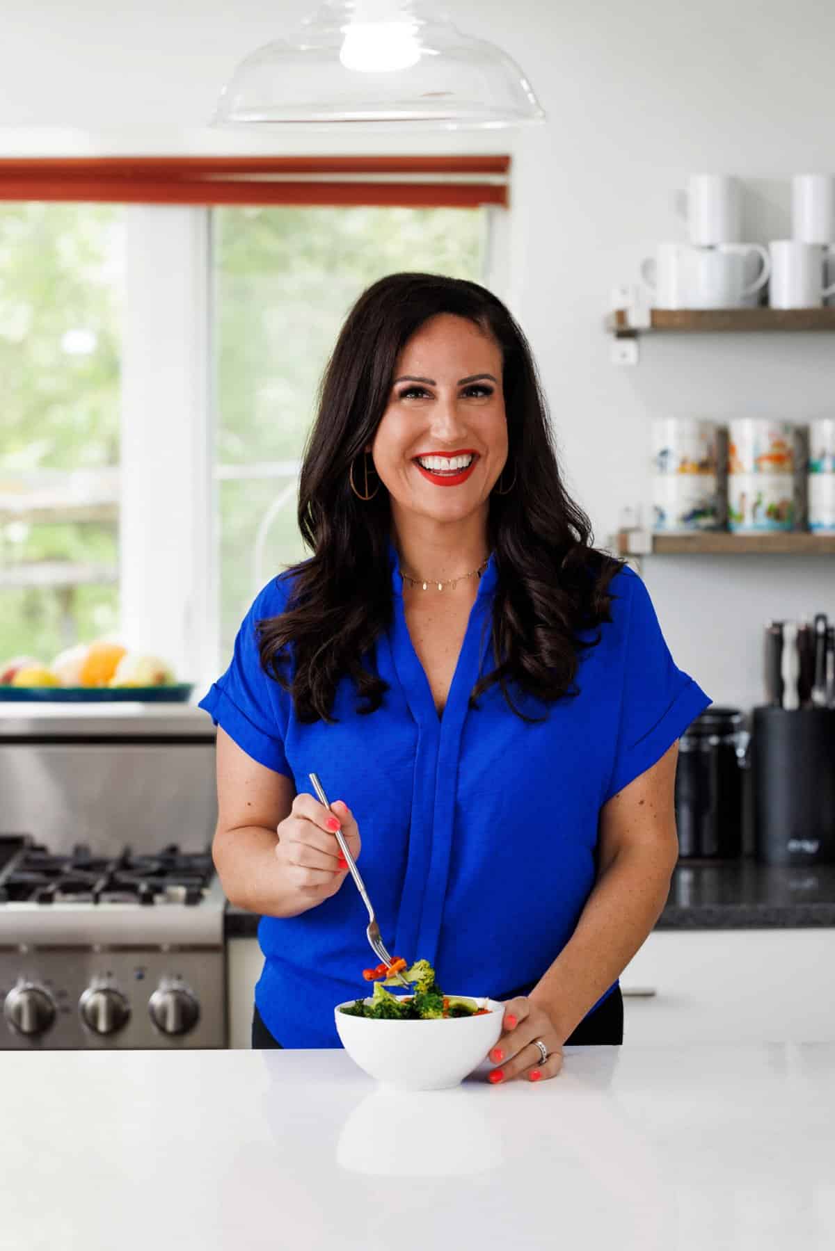 Liz eating mixed vegetable stir-fry.
