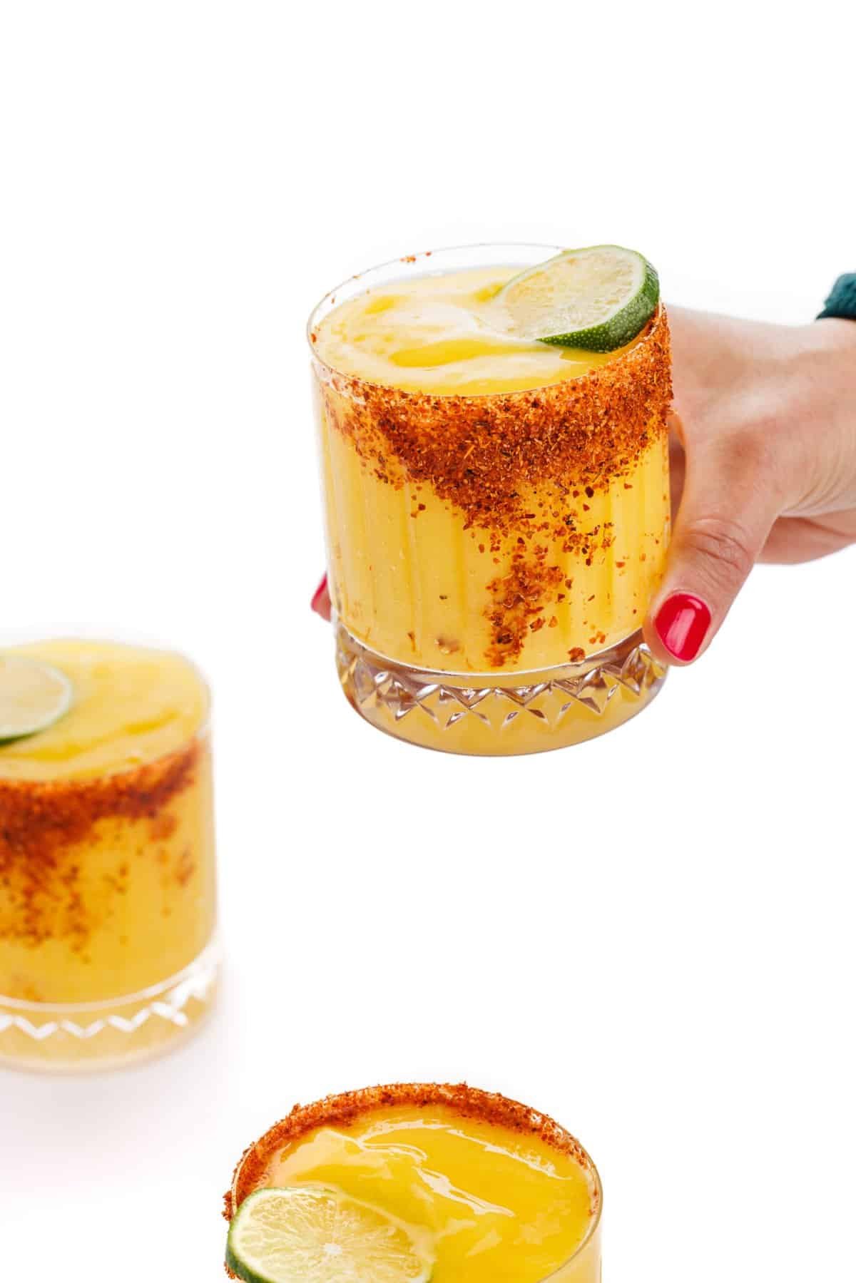 Holding a frozen mango margarita.