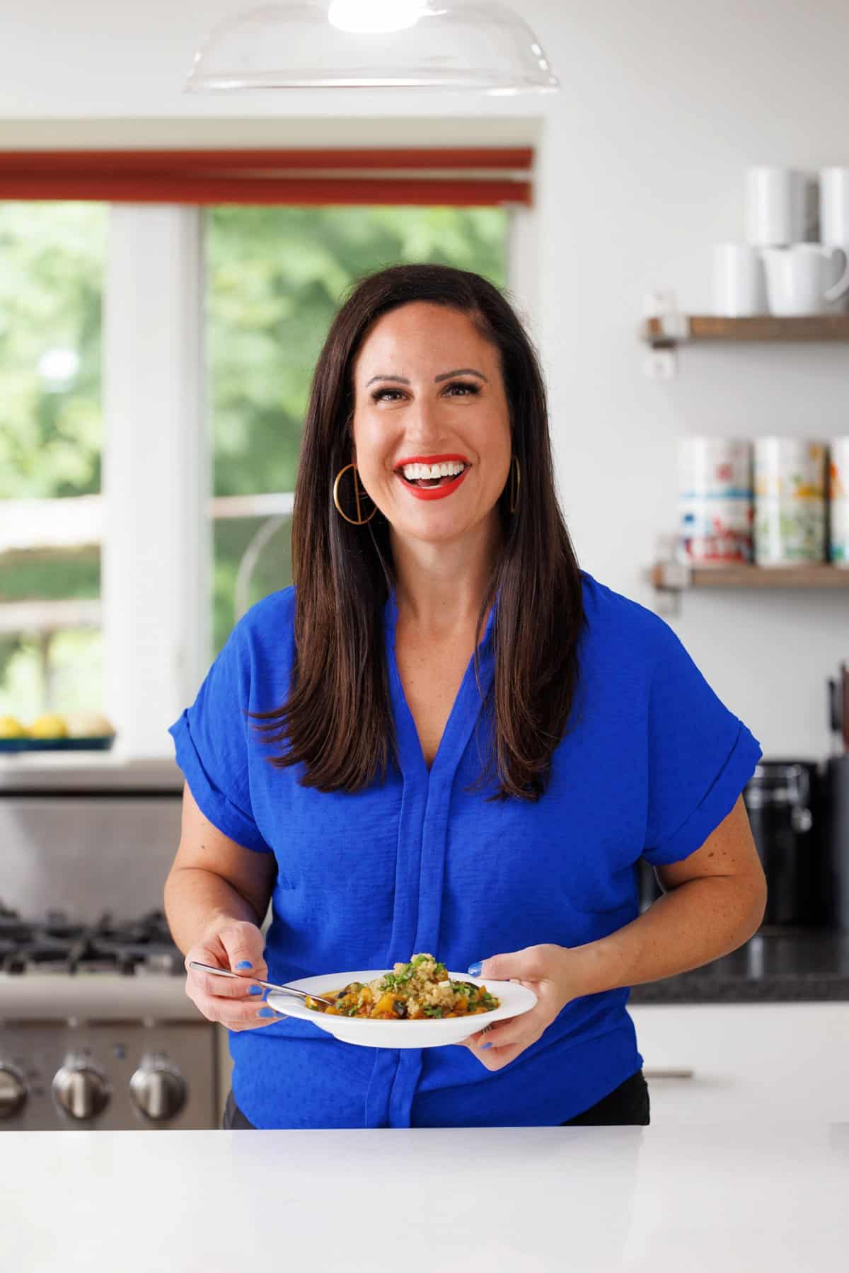 Liz eating vegetable tagine with chickpeas