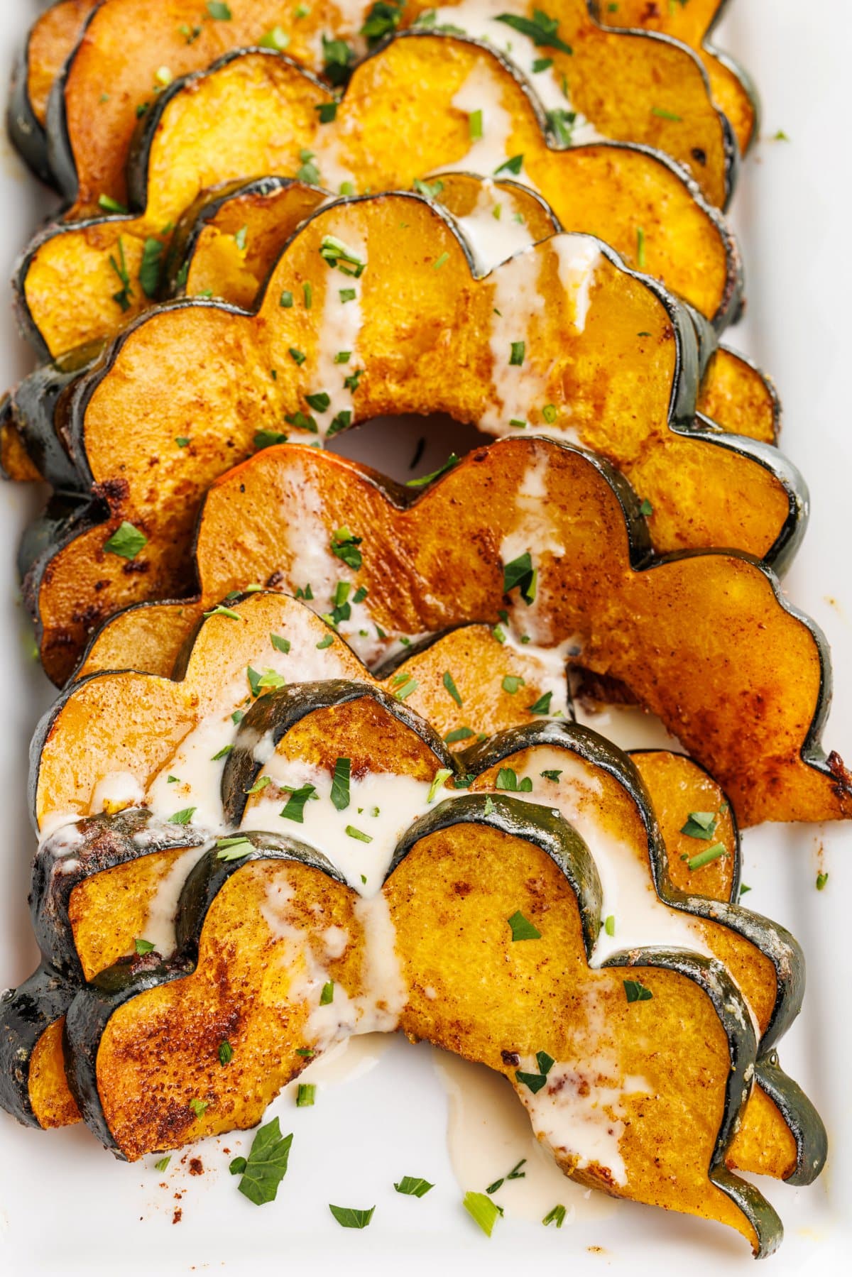 Roasted acorn squash with tahini sauce.
