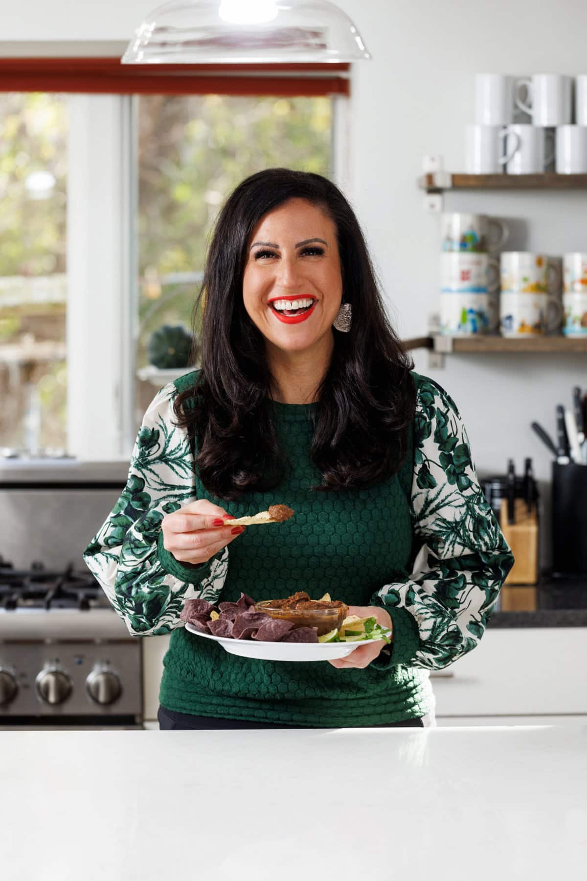 Liz Della Croce eating black bean dip