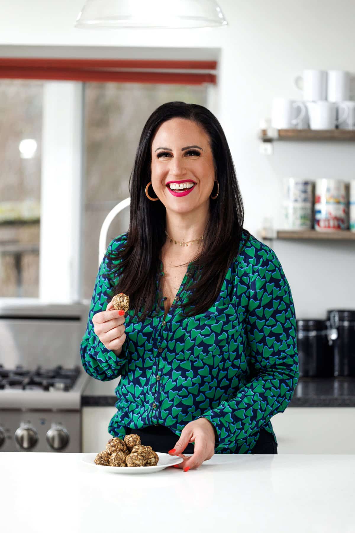 Liz eating no bake chocolate chia energy bites.