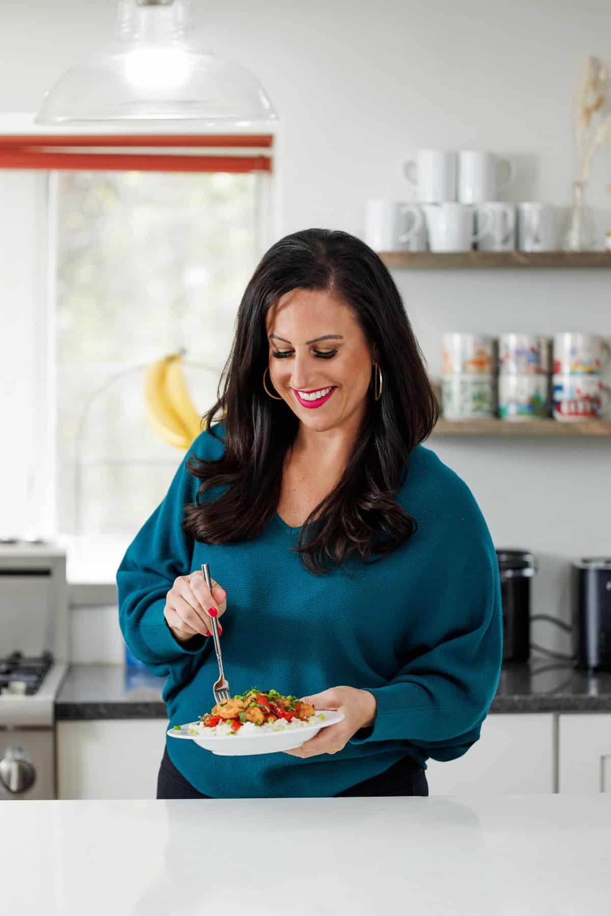 Liz eating Thai basil shrimp.